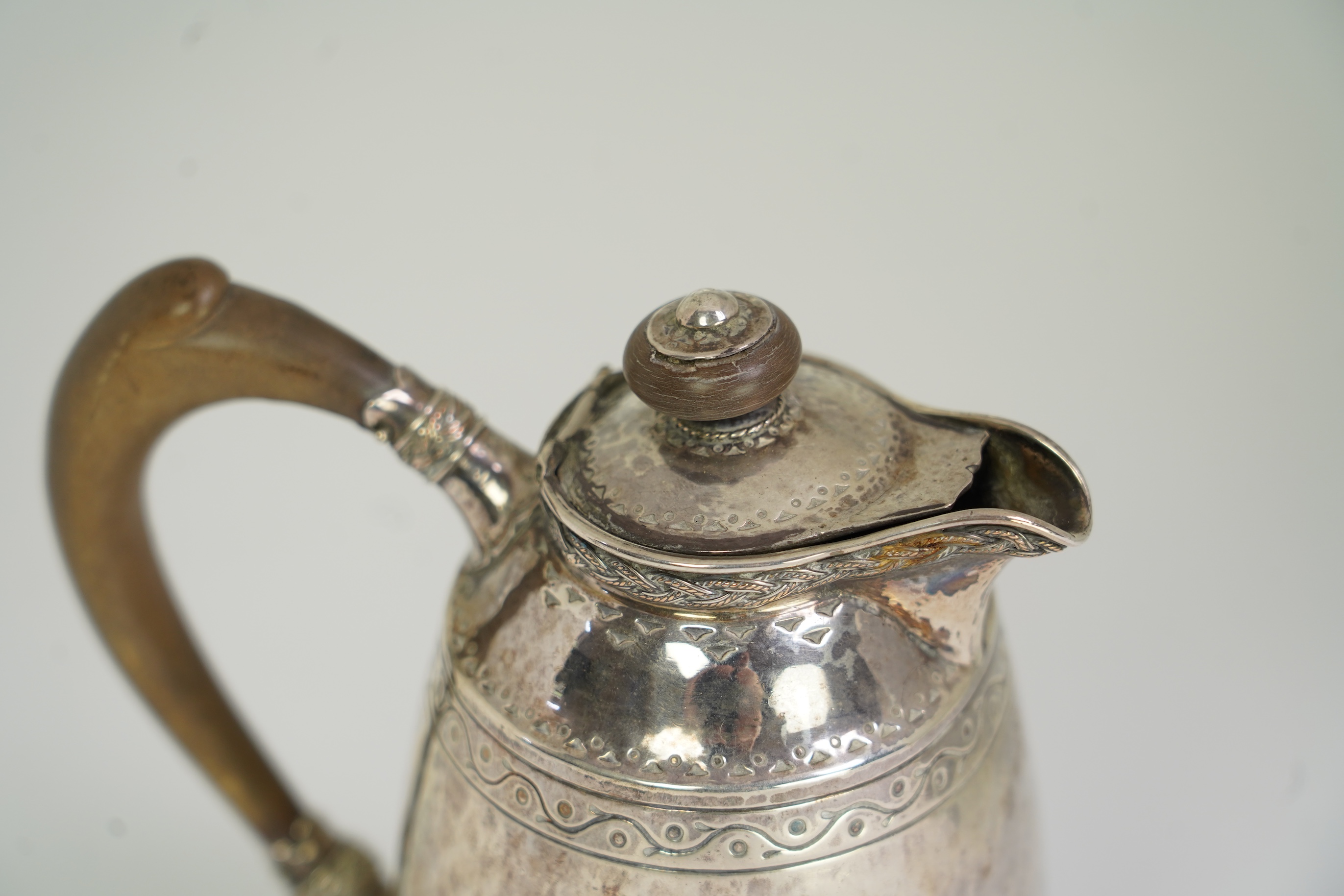 A George V Arts & Crafts silver hot water pot by Liberty & Co